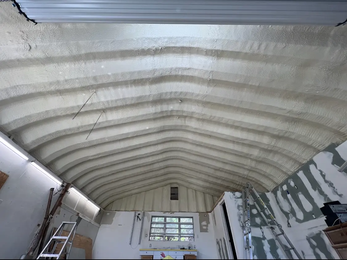 Spray polyurethane foam applied to the underside of a metal roof deck in Monfort Heights